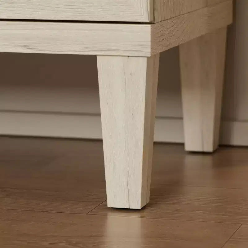 Comò grande a 9 cassetti con finitura effetto legno chiaro